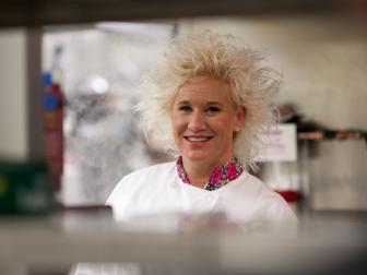 Host Anne Burrell behind the line in the kitchen of Zengo as seen on Food Network's Chef Wanted with Anne Burrell, Season 2.