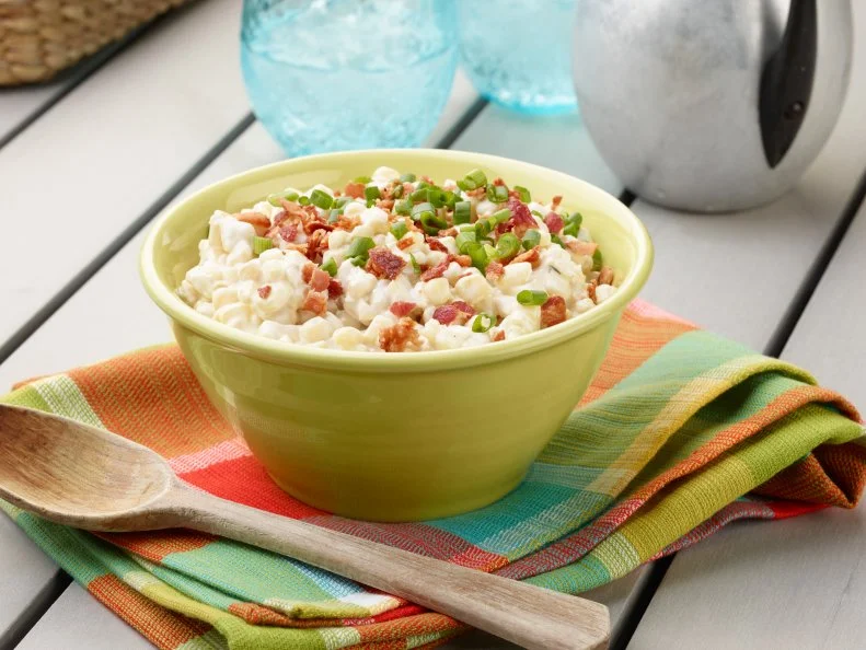 Food Network Kitchen’s Slow-Cooker Creamed Corn for Summer Slow Cooker/Zucchini Fries/Picnic Brick-Pressed Sandwiches, as seen on Food Network.