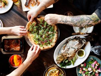 It’s an unlikely story. Ann Kim, a Korean immigrant, one day decided to quit her day job and open up South Minneapolis’ Pizzeria Lola, which is still one of the best pizzerias in the city. The James Beard Award semifinalist followed Lola with Hello Pizza, where you can buy your pizza by the slice, and then Young Joni, in northeast Minneapolis, where the wood-fired oven dominates the menu. At Young Joni, Kim celebrates her restaurant roots by serving her glorious traditional pizzas (yes, pepperoni is an option) and also creates more inventive ones like the Korean BBQ pizza, which pairs beef short ribs with fresh arugula tossed in a soy chili vinaigrette. She also stretches her wings a bit with a selection of globally inspired, wood-fired sharable plates like grilled confit mushrooms with chestnut miso butter and grilled New Caledonia blue prawns with red chili, fish sauce and lime.