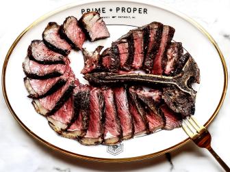 While many of the new Detroit restaurants have erred towards more casual concepts, Prime and Proper exudes full-on luxury. The dining room is a marvel, with a restored marble staircase from the original building, brass fixtures and plush velvet banquettes. Steaks are dry-aged and butchered in house with the modern dry-aging room visible to the dining room through full-length glass windows. Steaks, which include A-5 wagyu cuts, can be served with a torched foie gras with strawberry jam, pistachio, sea salt and Thai basil, and are better with a side of bruleed roasted sweet corn.