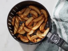 Food Network Kitchen’s Air fryer Dos and Don'ts, dont overcrowd the fryer ba, as seen on Food Network.