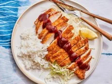 Description: Food Network Kitchen's Chicken Katsu. Keywords: Ketchup, Worcestershire Sauce, Soy Sauce, Eggs, Panko, Chicken Breasts, Cabbage, White Rice, Lemon