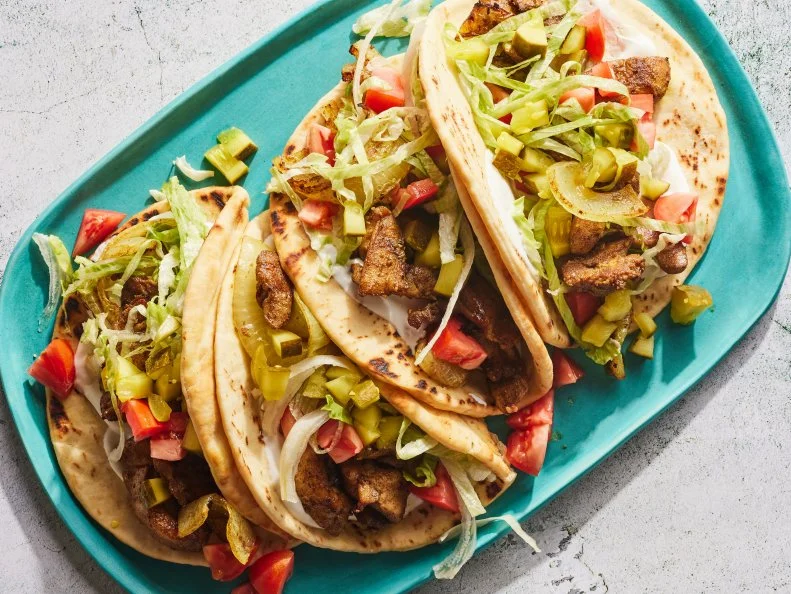 Description: Food Network Kitchen's Sheet Pan Chicken Shawarma.