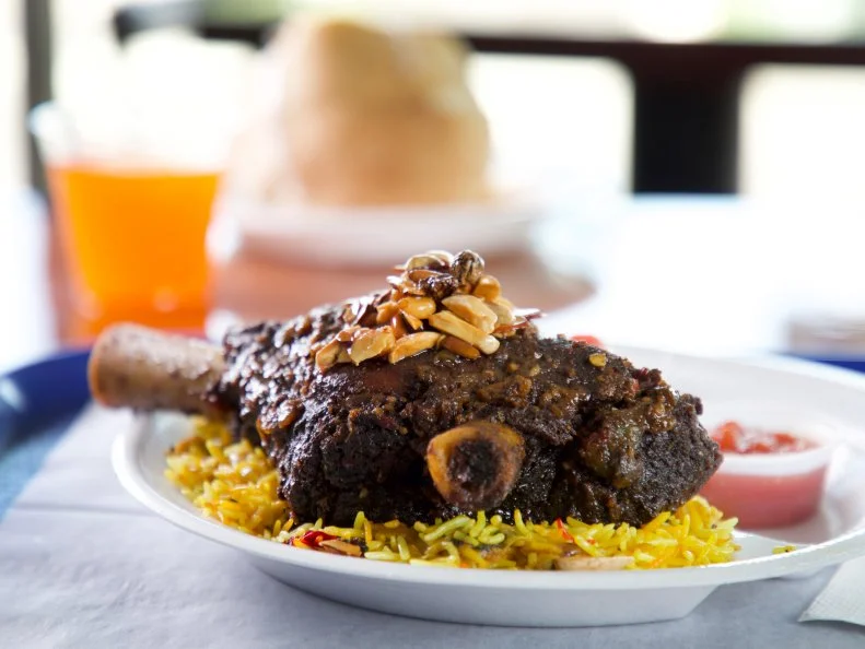 Lamb Shanks with Biryani Rice as served by Fattoush Café in Nashville, Tenessee, as seen on Diners, Drive-ins and Dives, season 34.