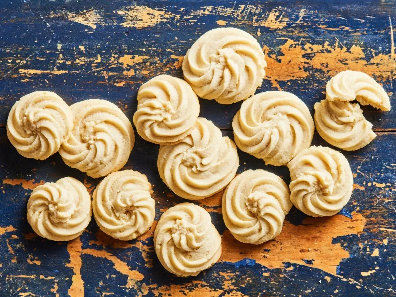 Description: Food Network Kitchen's Danish Butter Cookies. Keywords: Whole Milk, Vanilla Extract, Almond Extract, Egg, Sugar.