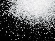 Close up Monosodium glutamate, MSG on black background.