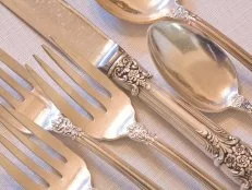 fine dining elegant antique silverware place setting.