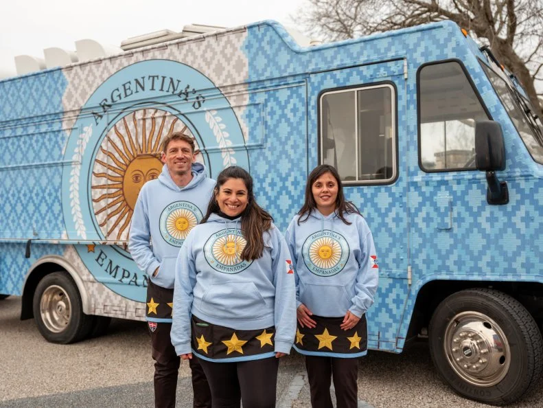 ARGENTINA’S EMPANADAS team members, Carolina Freeman, Paola Mentis and Chad Freeman, as seen on The Great Food Truck Race, Season 17.