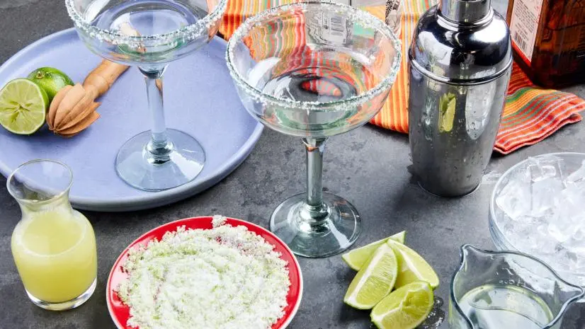 Photo showing all the ingredients laid out for the Margarita  recipe, as seen on Food Network.