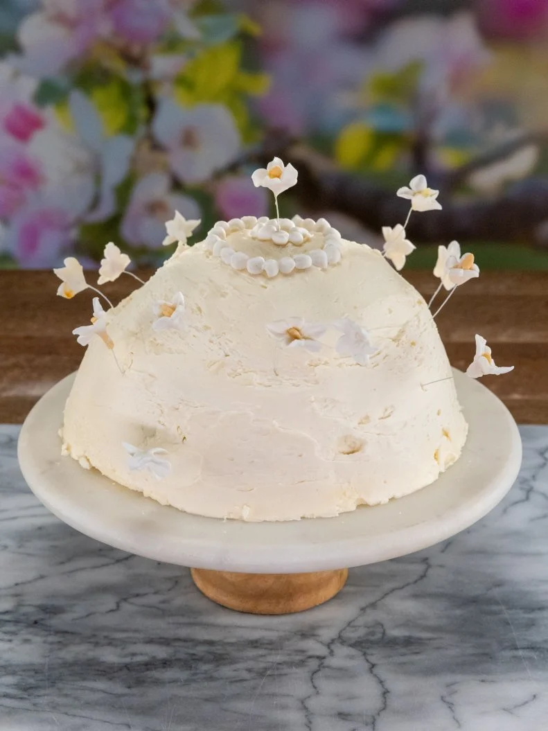 Contestant Michael Bass' round 2 dish, Lemon and Jasmine Olive Oil Cake, Lychee and Almond Pastry Cream, Jasmine Buttercream, as seen on Spring Baking Championship, Season 10.