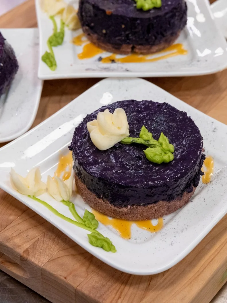 Contestant Anna Simeonides' round 1 dish, Ube Lime Macadamia No-Bake Cheesecake with Ube Sugar Cookie Crust, as seen on Spring Baking Championship, Season 10.