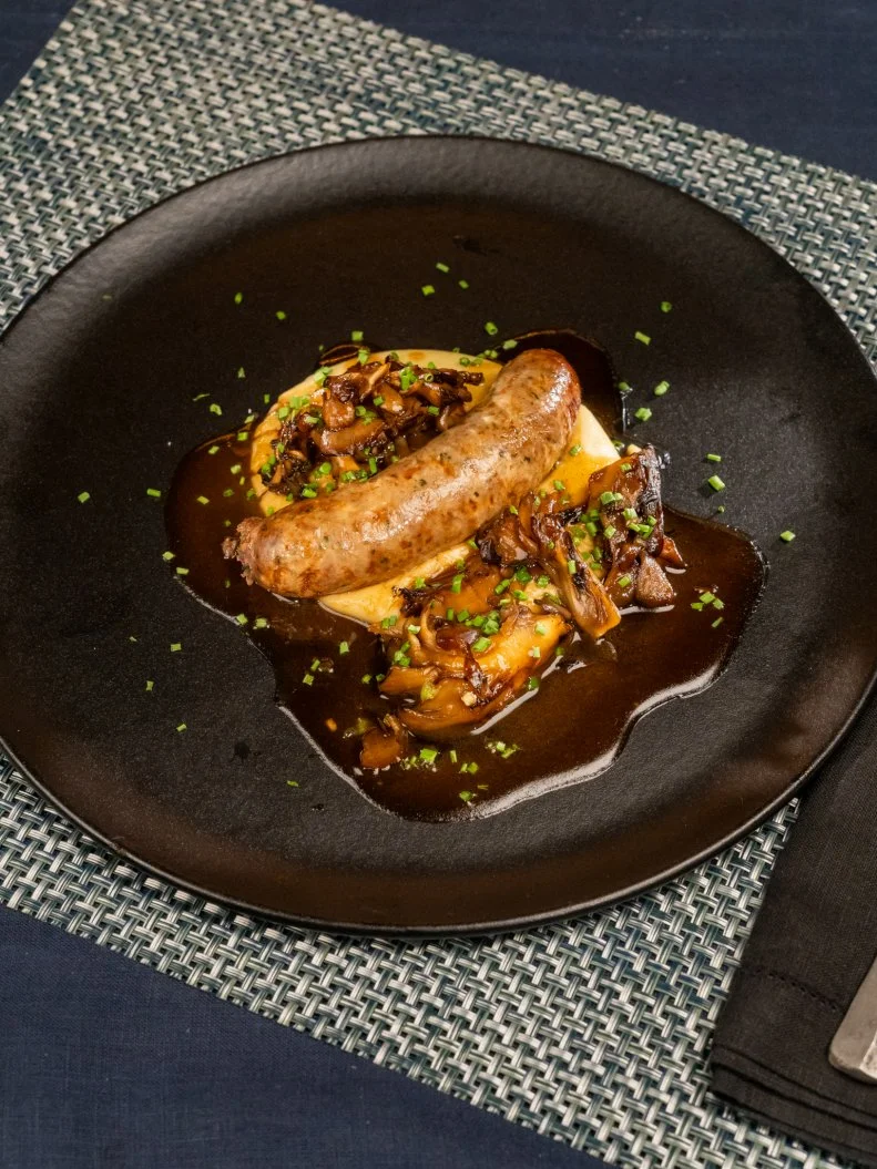 Contestant Antonia Lofaso’s hot dish is Spicy wagyu sausage and mash, as seen on Tournament of Champions, Season 6.