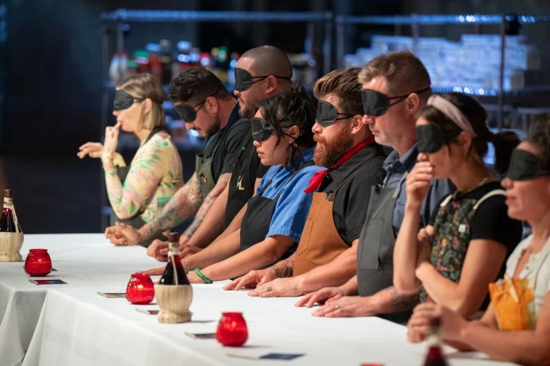 Chefs during a blind tasting challenge, as seen on 24 in 24: Last Chef Standing, Season 2.