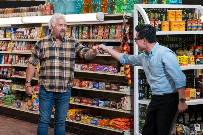 Viet Pham fist bumps Guy Fieri on Guy's Grocery Games