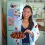 Portrait of Molly Yeh with her Strawberry Sprinkle Struffoli (inside out sufganiyot)  as seen in Girl Meets Farm Season 15