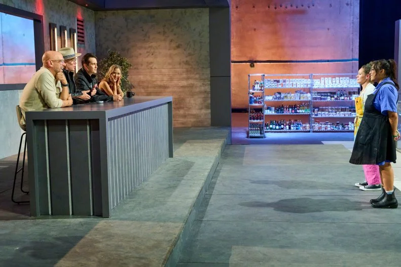 Contestants Nini Nyguen and Stephanie Izard listening to guest judges Brian Malarkey ,Carlos Anthony and hosts Michael Symon, Esther Choi discuss their dishes  as seen on 24 in 24: Last Chef Standing, Season 2.