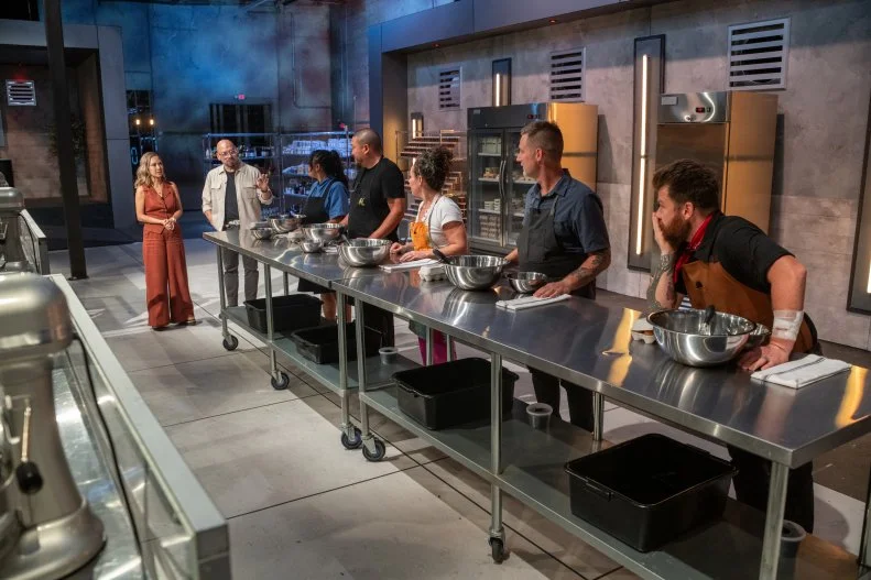 Hosts Michael Symon and Esther Choi with Chef Jonathon Sawyer, Chef Nini Nguyen, Chef Kevin Lee, Chef Stephanie Izard and Chef Bryan Voltaggio during the finale, as seen on 24 in 24: Last Chef Standing, Season 2.