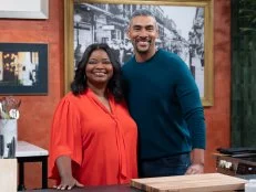 Dook Chase and Octavia Spencer pose for the camera together inside at one of the cook stations