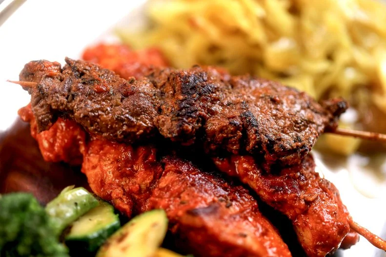 Chicken & Steak Combo Skewers prepped by Chef-owner Ermyias Shiberou at Stick Em in Memphis, Tennessee, as seen on Diners, Drive-In's and Dives, season 38.