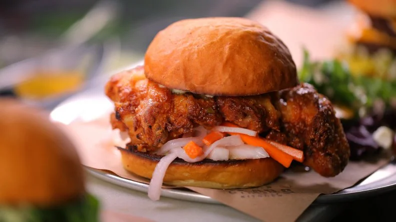 Vietnamese Fried Chicken Sandwich as Served at Bread and Circus Sandwich Kitchen in Sioux Falls, South Dakota as seen on Food Network's Diners, Drive-Ins and Dives episode DV3306H.