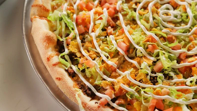 The Dirty Taco Pizza as served at Dirty Water Dough in Boston, Masssachusetss, as seen on Diners, Drive-Ins and Dives, Season 30.