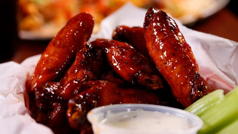 The Smoked chicken wings from Smokey D's BBQ in Des Moines, IA, as seen on Food Network's Diners, Drive-Ins and Dives, Season 21.