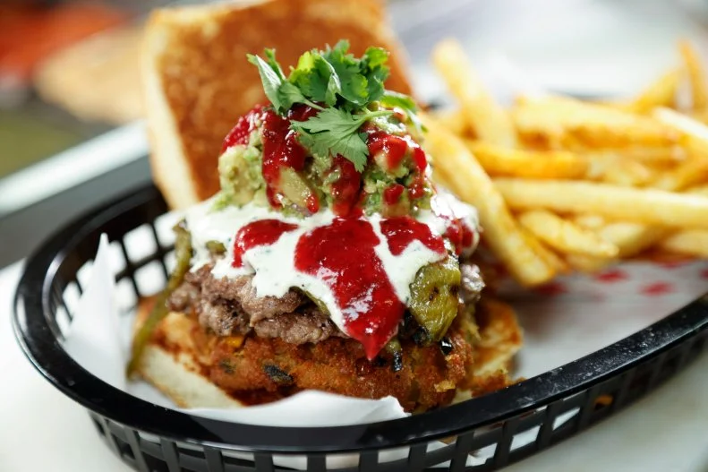 ,The Fritter Burger prepped by Chef/owner Bert Shapiro at Paradise Valley Burger in Phoenix, Arizona, as seen on Food Network's Triple D Nation, season 6.