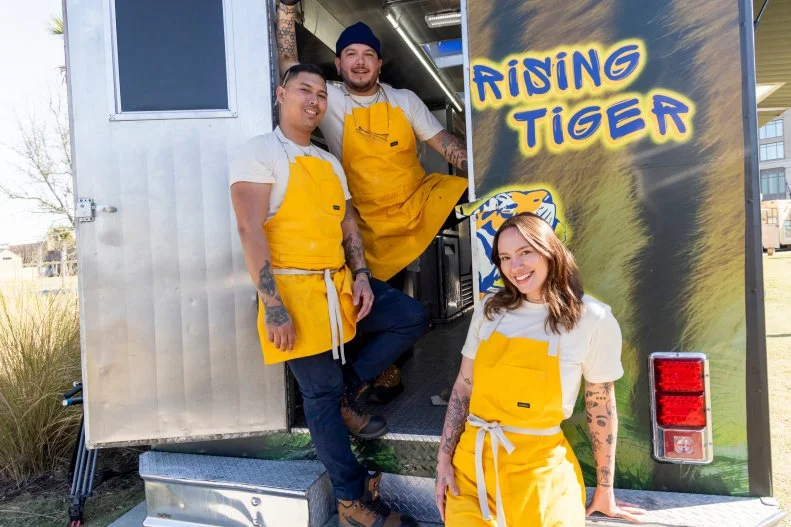 Rising Tiger team members in front of their food truck