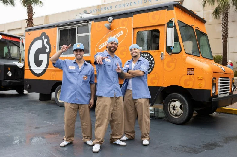G's Cheesesteak team members in front of their food truck