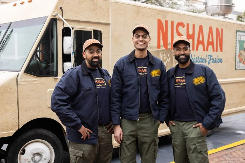 Nishaan team members in front of their food truck