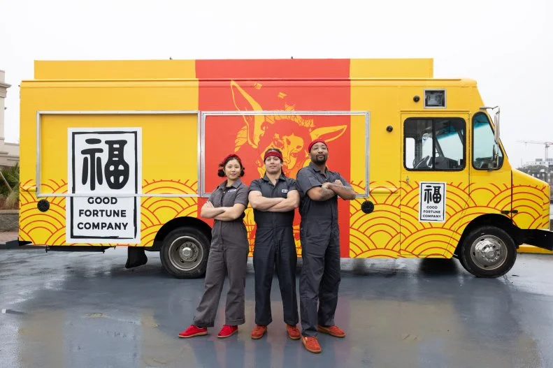 Good Fortune Company team members in front of their food truck