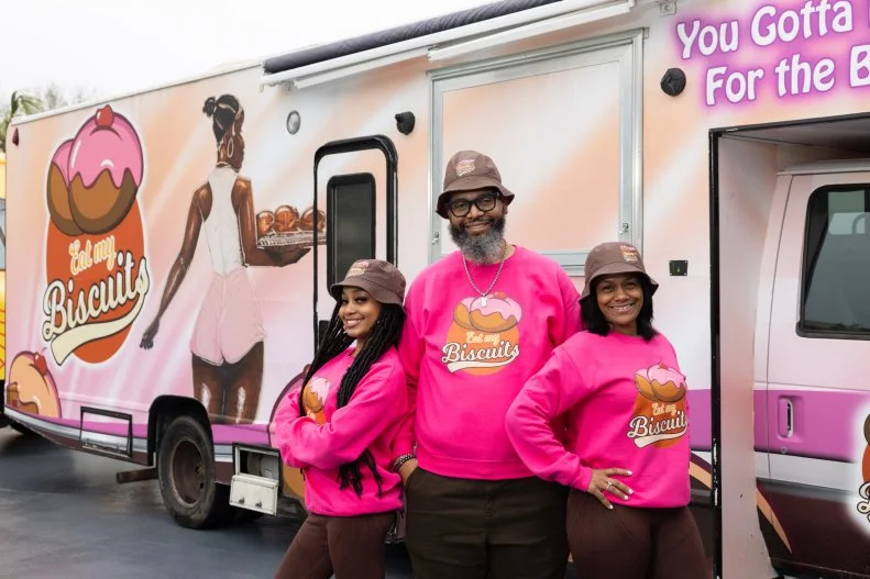 Eat My Biscuits team members in front of their food truck