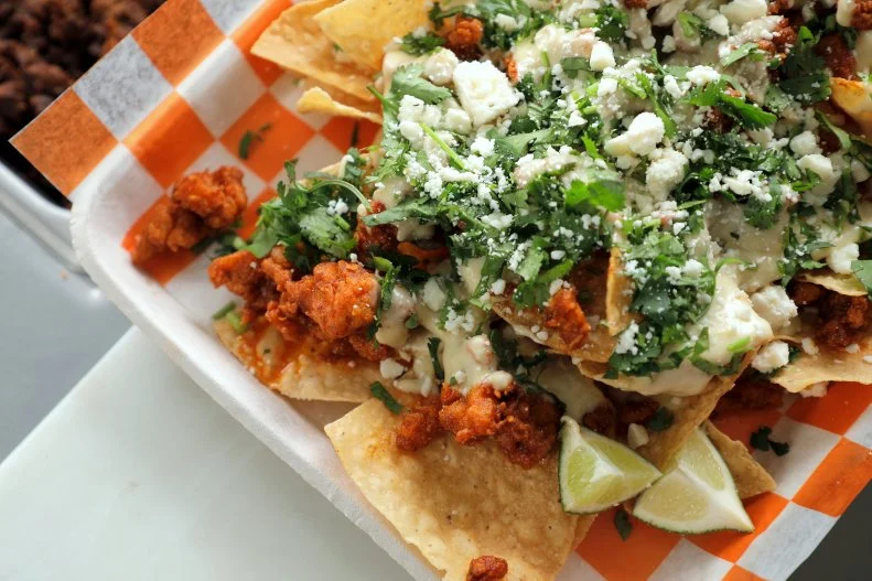 Nashville Hot Chicken Nachos as served at Pie Town Tacos in Nashville, Tennessee, as seen on Diners, Drive-Ins and Dives, Season 35.