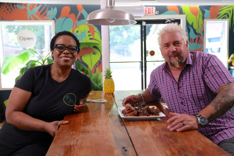 Host Guy Fieri poses for a picture with owner Ouida Kuhlokoh-Bradshaw at Jamaica Way in Nashville, Tennessee, as seen on Triple-D Nation.